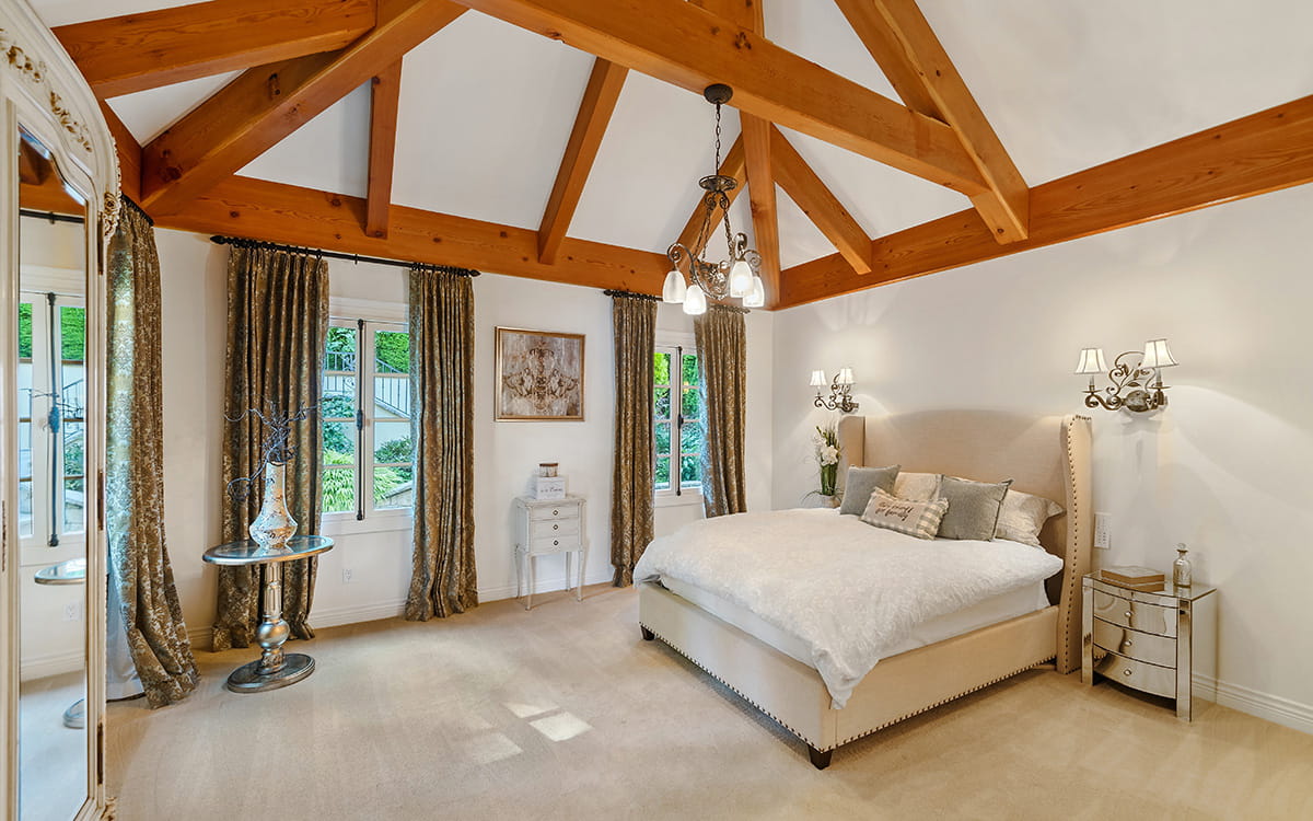 Bedroom in loft with roofbeams