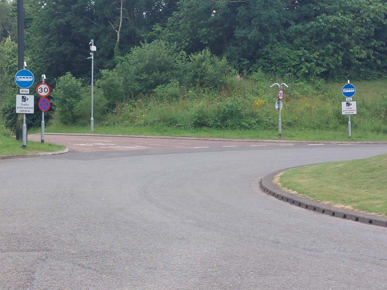 Birchwood bus lane - signage at the entrance and exit of the bus lane on the roundabout on Birchwood Way